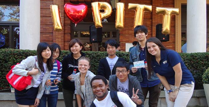 Students gather in a group for a photograph.
